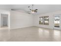 Bright living room featuring tile floors and large windows at 1360 Franklin Ln, North Port, FL 34286