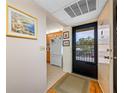 Condo entryway with view into kitchen at 14130 Rosemary Ln # 2203, Largo, FL 33774