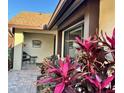 Inviting front porch adorned with colorful plants and decorative accents for relaxing outdoors at 2217 Sequoia Dr, Clearwater, FL 33763