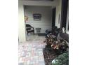 Cozy front porch with seating area and plants at 2217 Sequoia Dr, Clearwater, FL 33763