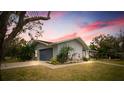 House exterior showcasing architectural details and curb appeal at sunset at 3006 Mockingbird Ct, Clearwater, FL 33762