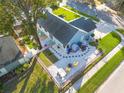 Aerial view of the home's backyard, showcasing a patio and landscaping at 3102 Jarvis St, Holiday, FL 34690