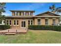 Brick patio and lush landscaping in a fenced backyard at 402 Islebay Dr, Apollo Beach, FL 33572