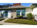 Condo exterior showcasing a neat lawn and updated facade at 4361 Tahitian Gardens Cir # C, Holiday, FL 34691