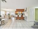 Open kitchen with breakfast bar and view into dining area at 6040 Antrim St, New Port Richey, FL 34653