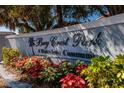 Bay Crest Park waterfront community sign displayed with colorful landscaping at 8307 Boxwood Dr, Tampa, FL 33615