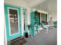 Inviting front entrance with teal door and charming decor at 9920 34Th N Way, Pinellas Park, FL 33782