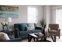 Living room features a comfy couch and tiled floors at 10355 Paradise Blvd # 212, Treasure Island, FL 33706