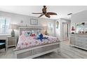 Coastal-themed main bedroom with private access to bathroom at 13477 Irwin Dr, Port Charlotte, FL 33953