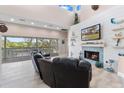 Relaxing living room with fireplace and water views at 13477 Irwin Dr, Port Charlotte, FL 33953