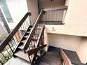 Exterior condo building staircase with metal railings at 1400 Tarpon Woods Blvd # H6, Palm Harbor, FL 34685