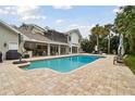 Inviting pool area with spacious patio and lounge chairs at 16403 Zurraquin De Avila, Tampa, FL 33613