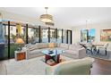 Spacious living room with large windows, offering ample natural light and city views at 199 Dali Blvd # 407, St Petersburg, FL 33701