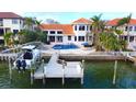 Luxury waterfront home with private dock and boat lift at 301 Midway Is, Clearwater Beach, FL 33767