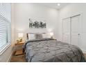 A cozy bedroom features a comfortable queen bed and a wardrobe closet at 3027 Bermuda Sloop Cir, Ruskin, FL 33570