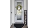 A welcoming front door with a decorative wreath and a charming 