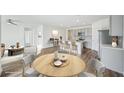 Modern kitchen with island, breakfast bar, and gray cabinetry at 31814 Oyster Trellis Ln, Wesley Chapel, FL 33545