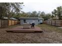 Backyard features a raised wooden deck perfect for relaxing at 438 E Martin Luther King Jr Dr, Tarpon Springs, FL 34688