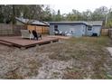 Large backyard with a wooden deck and plenty of space at 438 E Martin Luther King Jr Dr, Tarpon Springs, FL 34688