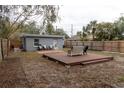 Spacious backyard with a large deck and a fenced-in area at 438 E Martin Luther King Jr Dr, Tarpon Springs, FL 34688