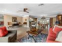 Spacious living room with tiled floors, comfortable seating, and a view of the kitchen at 5166 39Th S St, St Petersburg, FL 33711