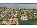 Property location shown with green arrow in aerial view at 601 Ambassador Ln, Holmes Beach, FL 34217