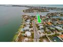 Property location shown with green arrow in aerial view at 601 Ambassador Ln, Holmes Beach, FL 34217