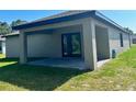 Covered patio with paver stones and sliding glass doors at 7220 Swartburg Rd, North Port, FL 34291