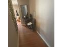 Home hallway with wood flooring and a small workspace at 8431 Edgewater Place Blvd, Tampa, FL 33615