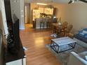 Living room features hardwood floors, a dining area, and comfy seating at 8431 Edgewater Place Blvd, Tampa, FL 33615