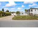 Cute bungalow with a spacious yard and paver driveway at 105 3Rd St, Belleair Beach, FL 33786