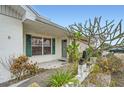 House exterior showcasing entrance with landscaping at 1207 Eastloch Ct, Sun City Center, FL 33573