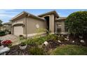 One story house with a two car garage and nicely landscaped front yard at 1531 Riverdale Dr, Oldsmar, FL 34677