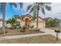 Single-story house with a two-car garage and lush landscaping at 1706 Kirtley Dr, Brandon, FL 33511