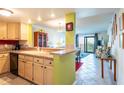 Condo kitchen with light wood cabinets and black appliances at 5020 Bayshore Blvd # 403, Tampa, FL 33611