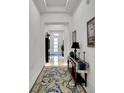 Bright and spacious entryway with elegant flooring and a console table at 705 Pinckney Dr, Apollo Beach, FL 33572
