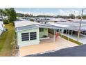Bird's-eye view of a light green manufactured home at 7050 El Matador St, Zephyrhills, FL 33541