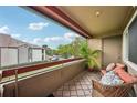 Relaxing screened balcony with patio furniture and a view at 10263 Gandy N Blvd # 2206, St Petersburg, FL 33702