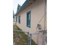 Side of house, teal accents, chain link fence at 1106 Carlton St, Clearwater, FL 33755