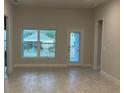 Dining room with tile flooring and access to the backyard at 13287 Ogden Glade Rd, Dade City, FL 33525