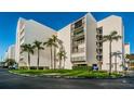 White building exterior with lush landscaping at 19111 Vista Bay Dr # 304, Indian Shores, FL 33785