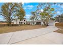 House and property view with new construction next door at 2504 W Fletcher Ave, Tampa, FL 33618