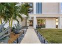 Landscaped walkway leading to the front entrance, featuring lush tropical plants at 2707 N Woodrow Ave # 3, Tampa, FL 33602