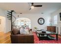 Spacious living room with a spiral staircase and comfortable leather sofa at 2812 W Neptune St, Tampa, FL 33629