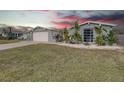 Ranch-style home with well-maintained lawn at 3435 Roxbury Dr, Holiday, FL 34691