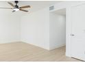 Bright bedroom with ceiling fan, light flooring and doors at 3630 E North Bay St, Tampa, FL 33610