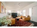 Bright living room featuring a fireplace, leather furniture, and a patterned rug at 4056 18Th S Ave, St Petersburg, FL 33711