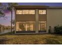 Back exterior view, showcasing the patio and screened enclosure at 4154 Pinelake Ln # 101, Tampa, FL 33618