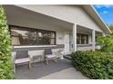 Inviting front porch with seating area and lush landscaping at 5243 27Th N Ave, St Petersburg, FL 33710