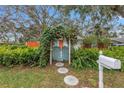 Inviting entryway with a charming arbor and a stone path at 5402 8Th S Ave, Gulfport, FL 33707